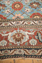 Intricate Turtle Samovar and Herati motifs within the main border of a distressed Persian rug.