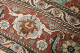 Worn texture on a distressed Veramin carpet, detailing the Turtle Samovar border in cherry red and blue.
