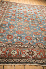 Angled view of a fine Veramin carpet, showing the Turtle Samovar border and allover Mina Khani design.