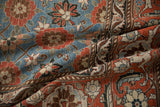 Intricate Turtle Samovar motifs on a draped vintage Veramin carpet in time-softened red and blue tones.