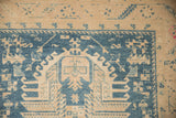 Worn texture showing knot heads through geometric patterns in dusty teal and antique ivory.