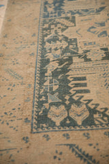 Even wear to knot heads on the serrated leaf border of this distressed Persian runner.