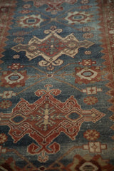 Angled perspective showing the runner's mostly even wear and repeating geometric medallions.