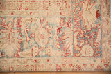 Low pile texture showing heavy abrashes on a vintage distressed Persian Ahar carpet.