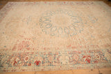 Low perspective across the distressed Persian Ahar carpet, revealing its mostly even wear and texture.