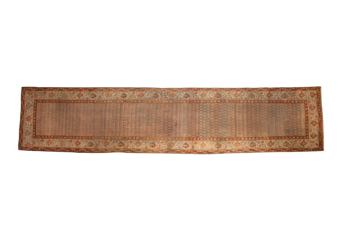 Vintage distressed Bijar runner with an allover boteh pattern in dusty teal, rust, and ivory.