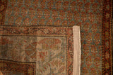 Reverse weave of a vintage Bijar rug showing the hand-knotted foundation and reinforced side binding.