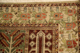 Corner detail of a vintage Bakhtiari carpet showing paneled borders and time-softened pile.