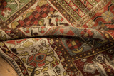 Detailed view of the hand-knotted pile and paneled garden motif on a vintage Bakhtiari carpet.
