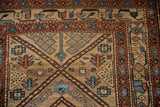 Visible knot heads within the seeded lattice field and vine borders of an antique Persian runner.