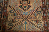 Detail of the low pile revealing geometric finials and seeded lattice on an antique Persian runner.