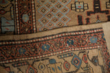 Corner view of the antique runner's intact side cord selvage and low, textured hand-knotted pile.