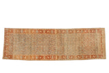 Vintage distressed Bijar runner with an allover Herati design in sky blue, terracotta, and sandalwood tones.