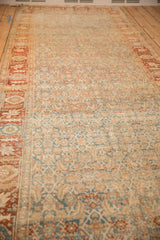Long perspective of the distressed Bijar runner showing terracotta borders and soft abrashes across the field.