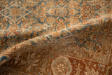 Distressed low pile of a vintage Bijar showing the sky blue and terracotta Herati pattern.