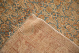 Corner view of the vintage Bijar runner showing its hand-knotted back and worn Herati pile.