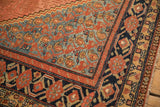 Geometric pomegranate and vine motifs in the complex borders of a late 19th-century Malayer rug.
