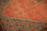 Geometric sky blue border beside the tone-on-tone red field of an antique Persian Malayer carpet.