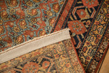 Back view showing the hand-knotted foundation and side cord of an antique Persian Malayer carpet.