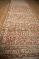 A long, angled view down the antique Malayer runner with its staggered boteh design.
