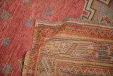 Close view of the low-pile knot heads and colorful reverse weave of a vintage Oushak.