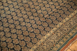 Antique Persian Tabriz carpet: navy field with staggered boteh and checkered scrolled vine border.
