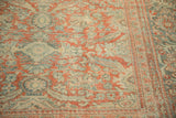 Distressed Mahal carpet detail: worn trefoil floral, lotus vine in pale brick red and dusty teal.