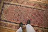 Fine antique Malayer runner with a repeating diagonal pattern in dusty blush and dark navy.