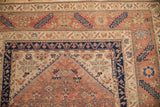Serrated leaf main border and barber-pole inner border of an antique Persian Malayer rug.