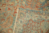 Distressed vintage Kashan rug, showing worn floral pile and intricate hand-knotted reverse.