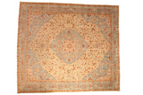 Distressed vintage Tabriz square carpet with a powder blue shield medallion on an ivory and rust floral field.