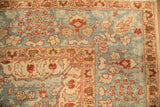 Worn texture on the powder blue field and ivory border of a distressed Persian carpet.