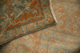 Folded corner of an antique Sarouk showing the short pile, secured end, and hand-knotted back.