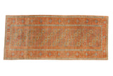 Vintage distressed Belouch runner with a repeating hexagonal gul design in rust red, dusty gold, and powder blue.