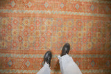 Geometric floral guls in hexagonal patterns with rust, gold, and powder blue on a distressed runner.