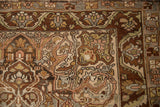 Close-up of the worn texture and serrated leaf border on a vintage Bakhtiari Persian rug.