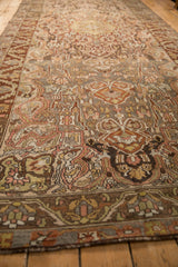 Angled view of a vintage Bakhtiari runner showing its even wear and detailed pattern.