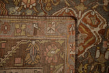 Corner view of a Persian Bakhtiari rug showing the hand-knotted foundation and secured side cord selvage.