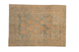 Distressed vintage Afshar rug with an allover pattern of apricot botanicals on a powder blue field with sandalwood borders.