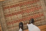 A view from above showing the scale and evenly worn texture of a distressed Bijar rug.