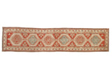 Distressed vintage Serab runner with geometric medallions in alternating pomegranate red and sky blue.