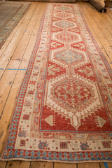 Angled view showing the full length of a distressed Serab runner and its geometric medallions.