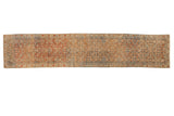 Vintage distressed Malayer runner with an allover Herati motif in terracotta, dusty blue, and sandalwood tones.