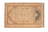 Distressed vintage Hamadan rug with a geometric medallion in ivory, brown, and sapphire blue.