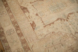 Detail showing the mostly even wear and hand-knotted texture of the distressed Hamadan rug.