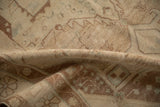 Worn hand-knotted pile of a distressed Hamadan rug in muted beige, brown, and dusty blue.