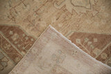 The hand-knotted back and secured side cord of a vintage distressed Hamadan rug.