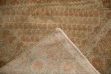 The back of a hand-knotted vintage Afshar rug showing its detailed weave and secured edge.