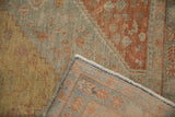 The hand-knotted back and powder blue selvage of a distressed Northwest Persian rug.