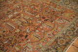 Low pile texture on a vintage Mehrivan carpet showing geometric floral and turtle border motifs.